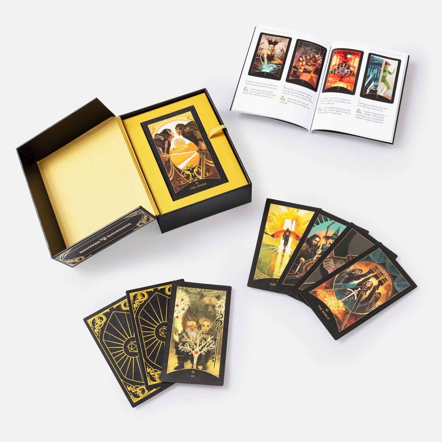 Tarot card set with cards spread out and box on a white background