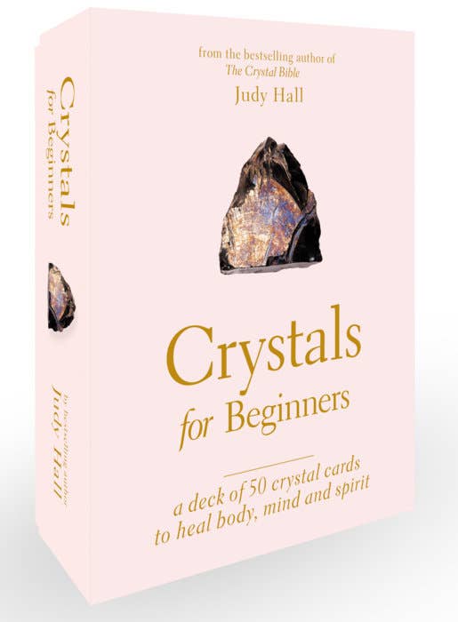 Card deck packaging for 'Crystals for Beginners' by Judy Hall on a light gray background